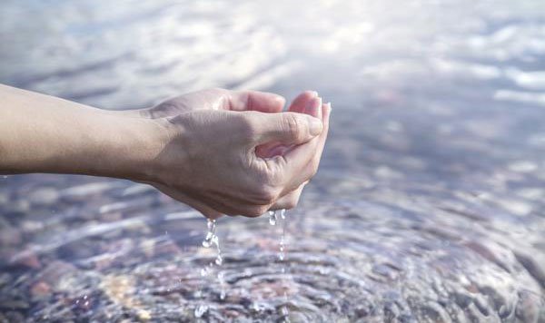Hands and fresh clean water